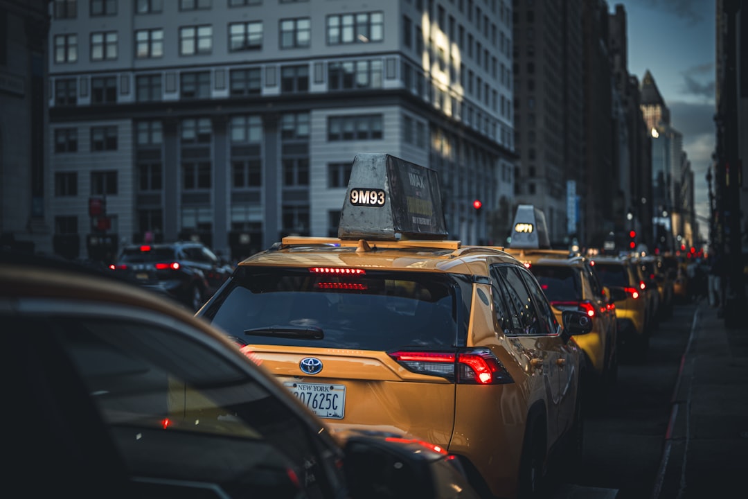 Yellow taxis in city traffic during the day