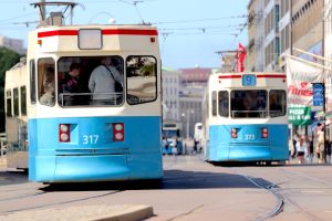 a couple of trolleys on a street