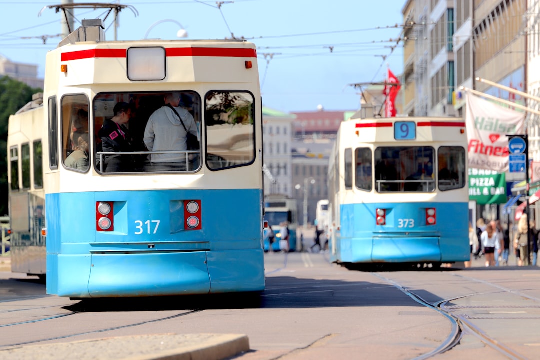 a couple of trolleys on a street