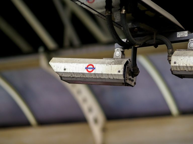 a close up of a metal object with a red and white sign on it